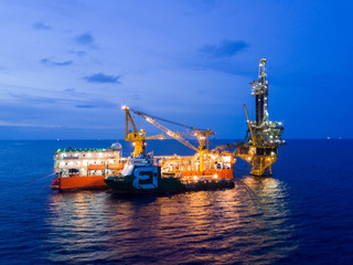Aerial View of Tender Drilling Oil Rig (Barge Oil Rig) in The Middle of The Ocean at Surise Time