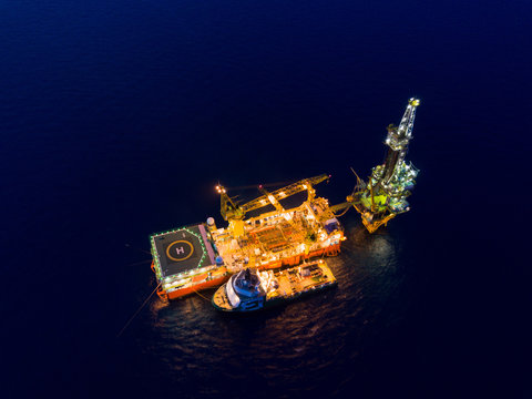 Aerial View of Tender Drilling Oil Rig (Barge Oil Rig) in The Middle of The Ocean at Surise Time
