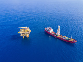 Soil Boring Boat (a geotechnical drilling cum analogue survey vessel) close to a oil platform