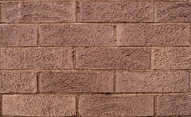 Close up of a brown brick wall