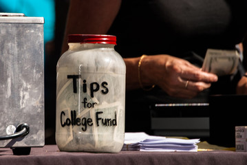 Tips Jar Sits on Counter