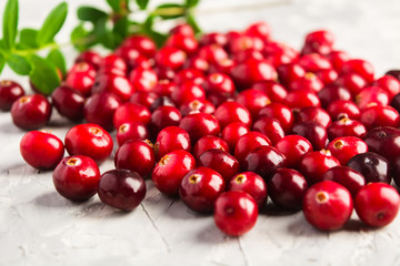 Fresh cranberries over grey background