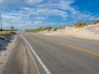 Road accross the sand dunes at