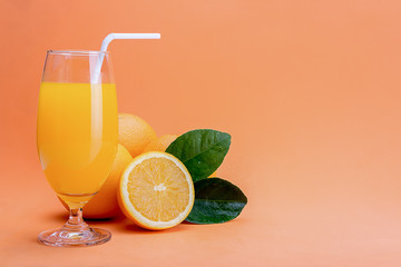 Orange juice in glass and fresh citrus around  on wooden table background fruit product display or montage