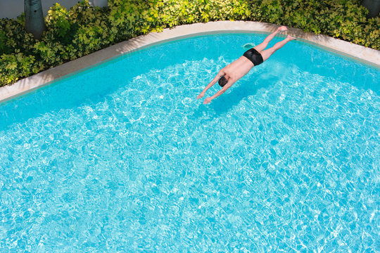 Top view of a man in the swimming pool.