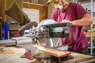 man cutting on a circular saw