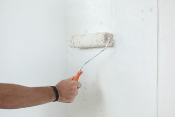 Hand painting wall in white