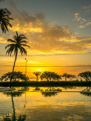 Fototapeta na wymiar Twilight sunrise sky at sea with pool