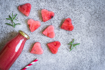 Watermelon rosemary smoothies in a bottle And pieces of watermelon in the form of heart