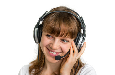 Fototapeta premium Smiling call centre operator with headset at workplace