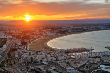 Beach in Agadir city at sunrise, Morocco - obrazy, fototapety, plakaty