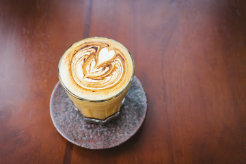 Coffee cup on wooden table.