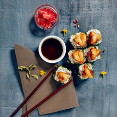 Obraz na płótnie Canvas Menu of Japanese sushi rolls on black background