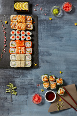 Menu of Japanese sushi rolls on black background