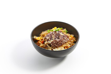 Special dishes of Pan-Asian cuisine in dark iron plate