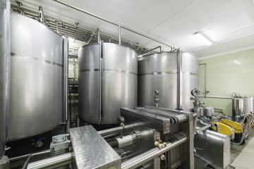 Industrial equipment, metal tanks in the liquor factory.