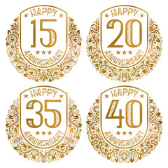 Happy anniversary emblems set. Vintage golden stamps for festive greetings and invitations.