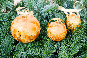 Photo of pine branches and Christmas ornaments