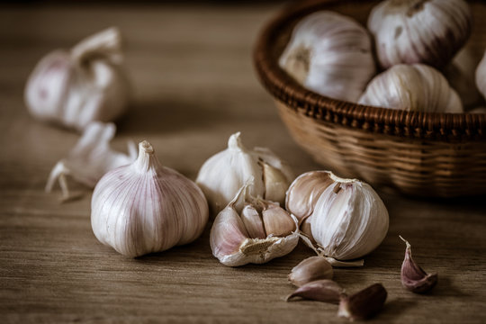 Close up group of garlic on kitchen wooden table