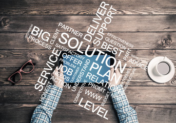 Close view of woman in checked shirt at her workplace