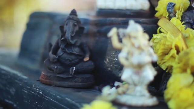 Lord Ganesha and Hinduism. Deity Ganesha with flowers, Ganesha as a symbol of Hinduism, the God of wisdom and prosperity. 1920x1080, hd