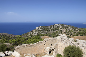 Ruins of the medieval castle of Kastellos in Kritinia with a beautiful view of the blue sea on the island of Rhodes (Greece).