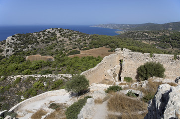 Naklejka premium Ruins of the medieval castle of Kastellos in Kritinia with a beautiful view of the Bay and mountains on the island of Rhodes (Greece).