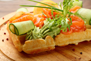 Belgium waffle with salmon and cucumber sauce
