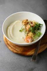 Cream-soup with salmon in bowl