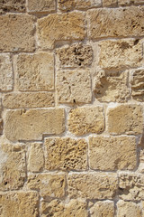 Fototapeta premium Yellow stone wall rustic background