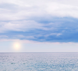 Sea simple view. Delicate colors of the sea and sky, the incoming foamy wave. Minimalism in colors and details. Free space for your texts and ideas.

