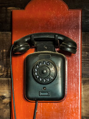 Black ancient analog phone from the beginning of the last century.