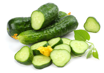 cucumber with sliced cucumber and leaf isolated on white background