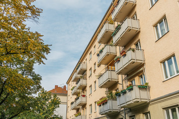 Fototapeta premium yellow apartment building with big balcony