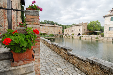 old thermal baths in the medieval village Bagno Vignoni, Tuscany, Italy