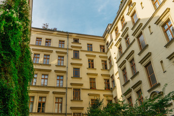 Fototapeta na wymiar beautiful yellow backyard of apartment houses with yellow facade