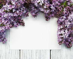 Lilac flowers with empty card