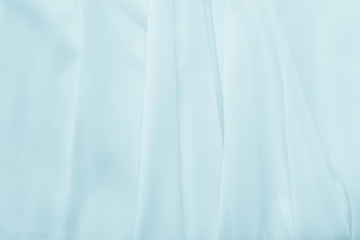 Abstract pastel blue waving fabric texture background