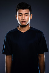 Portrait studio of a young handsome asian man