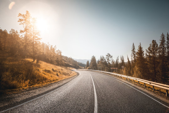 Road In Mountains. Sunset.