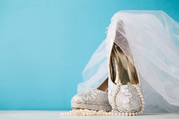 Beautiful arrangement of shoes sand bridal accessories