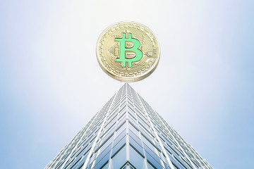 Bitcoin bubble on top of the skyscraper roof. Cryptocurrency concept.