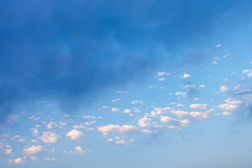 many white clouds and rainy gray cloud in blue sky