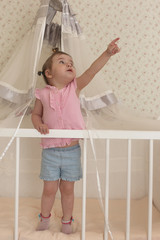 Young kid playing on a floor in a room