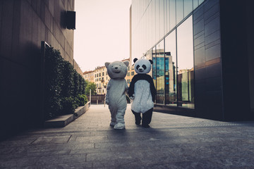 Teddy bear and panda having fun in the city