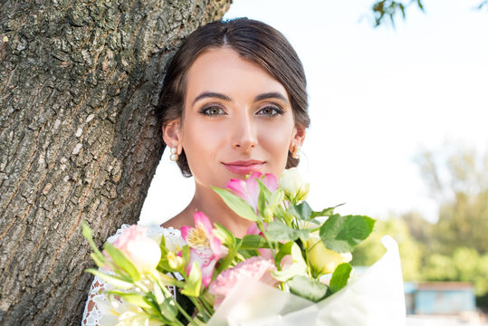 beautiful woman with bouquet of flowers