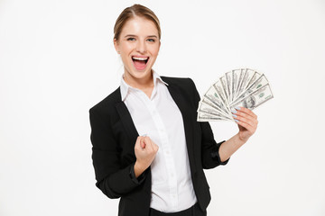 Happy screaming blonde business woman holding money