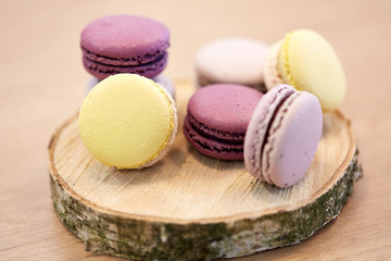 different macarons on wooden stand