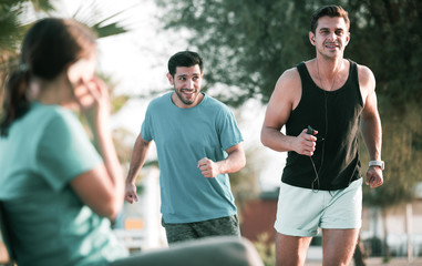 Portrait of adult man who is jogging with friend