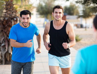 Fototapeta premium Adult men are jogging together